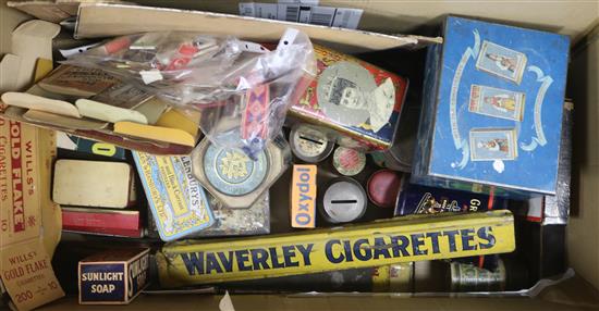 A quantity of tins and advertising signs